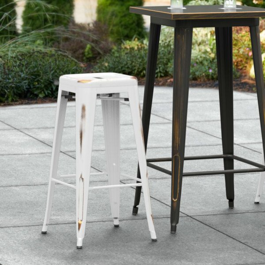 Outdoor Restaurant Bar Stools * | Cheap Lt&S Alloy Series Lancaster Table & Seating Alloy Series Distressed White Stackable Metal Indoor / Outdoor Industrial Barstool With Drain Hole Seat